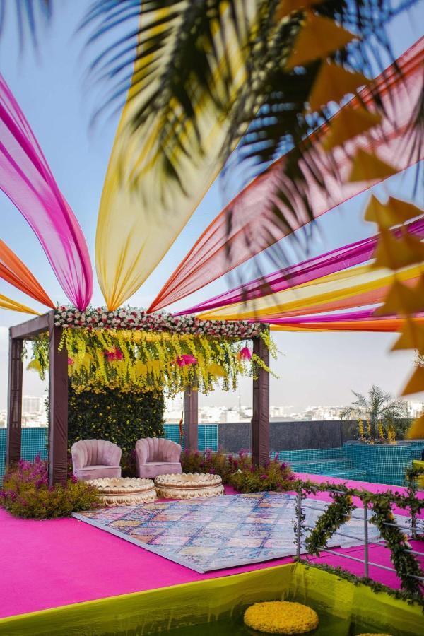 Radisson Blu Hotel New Delhi Dwarka Bagian luar foto A mandap decorated with colourful fabrics